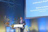 Wirtschafts- und Energie-Landesrat Markus Achleitner bei der Eröffnungsansprache zu den World Sustainable Energy Days in Wels am Rednerpult.