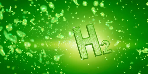 H2-Schriftzug und Wasserstoffmoleküle auf grünem Hintergrund.