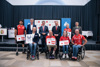 Gruppenbild, in der ersten Reihe Florian Brungraber, Ernst Bachmaier, Elisabeth Egger und Walter Ablinger, zweite Reihe Mendy Swoboda, Werner Steinecker, Landesrat Markus Achleitner, Landeshauptmann Mag. Thomas Stelzer, Yvonne Marzinke und Gerhard Bojtos. Im Hintergrund eine Bühne mit Rollplakaten mit Beschriftung Sport Oberösterreich, Olympiazentrum Oberösterreich